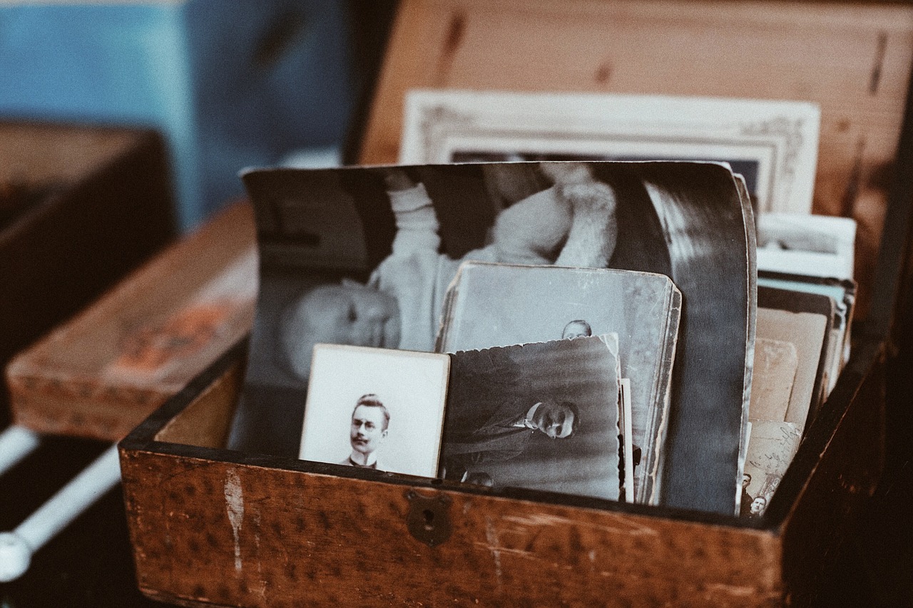 A box of photos to be added to a family history printed book