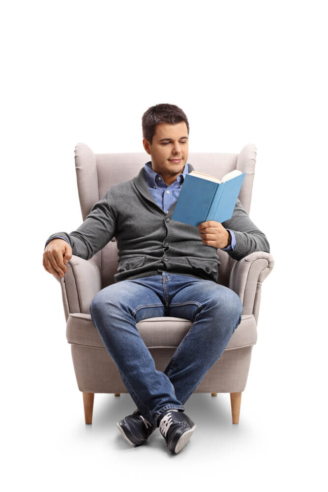 A man reading a self-published hardcover book