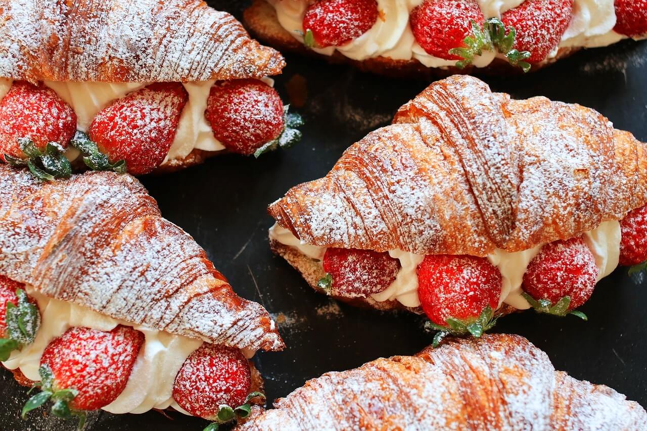 A strawberry croissant image appearing in a custom printing service menu by InstantPublisher