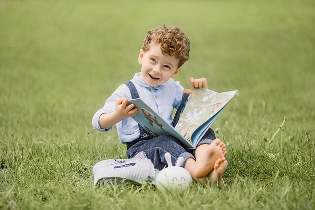 A child reading a self-publishing author’s book from a book printer