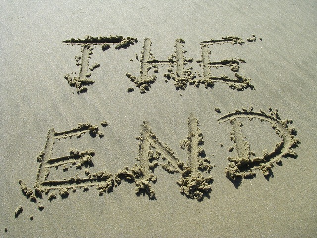 The End written in the sand as a metaphor for the end of the novel written by the self-publishing author